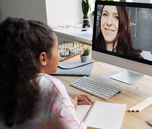 girl with teacher in virtual class