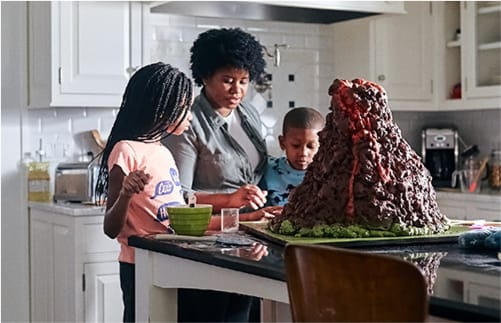 Mother and her children working together on a science project