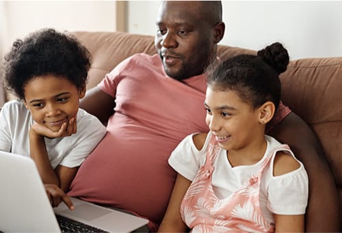 Father and children working together at home